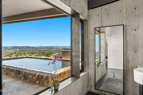 a view of an ocean and floor to ceiling window