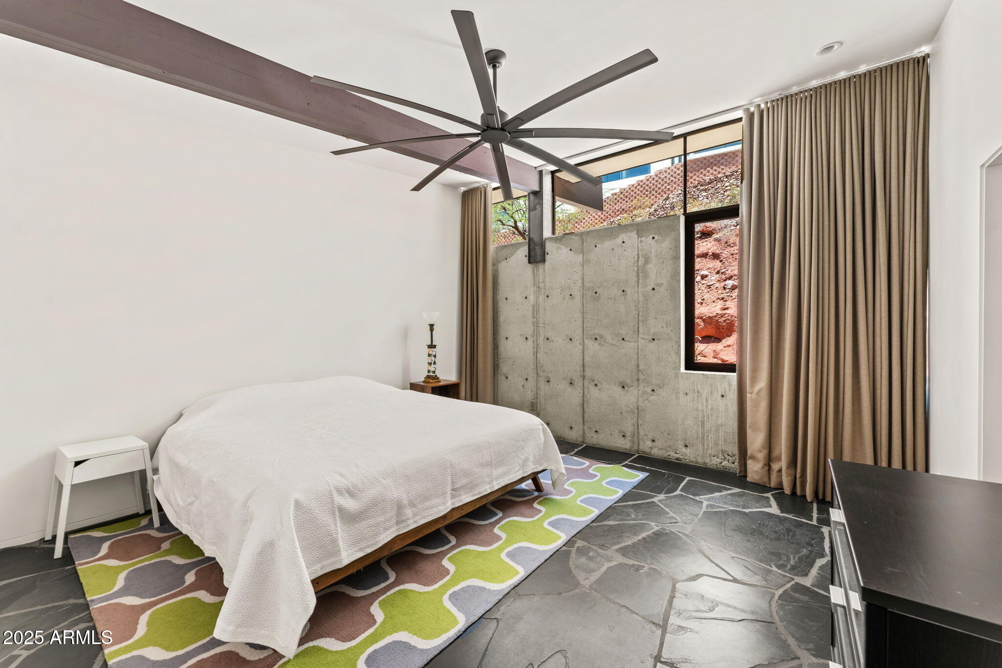 4925 East Red Rock Drive, Unit 43 Phoenix, AZ 85018 - Photo 52 of 99 a bedroom with a bed and a window