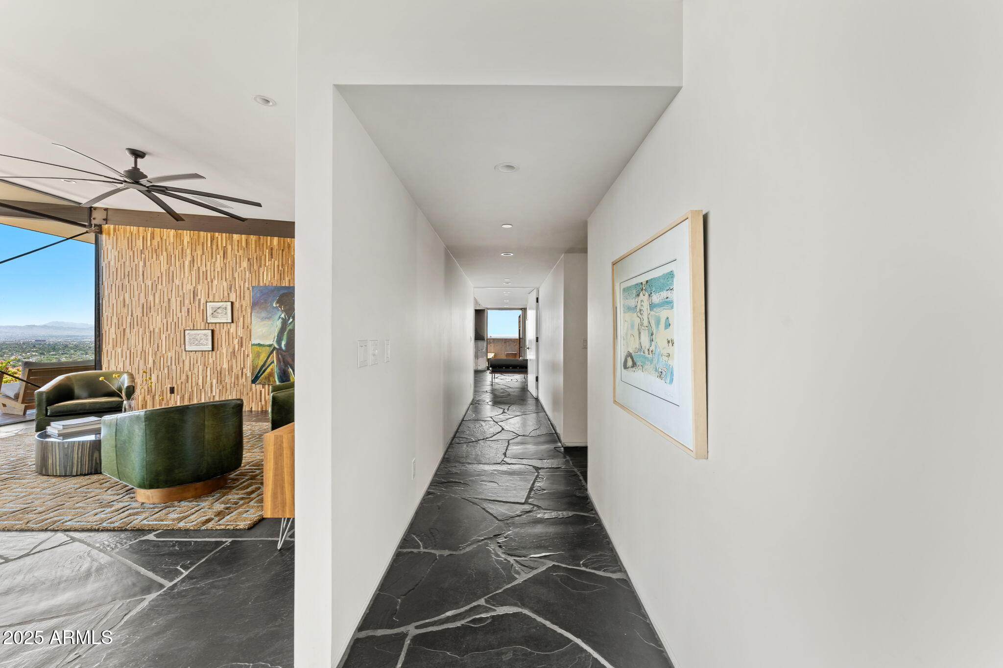 4925 East Red Rock Drive, Unit 43 Phoenix, AZ 85018 - Photo 55 of 99 a view of a hallway with the back of the house