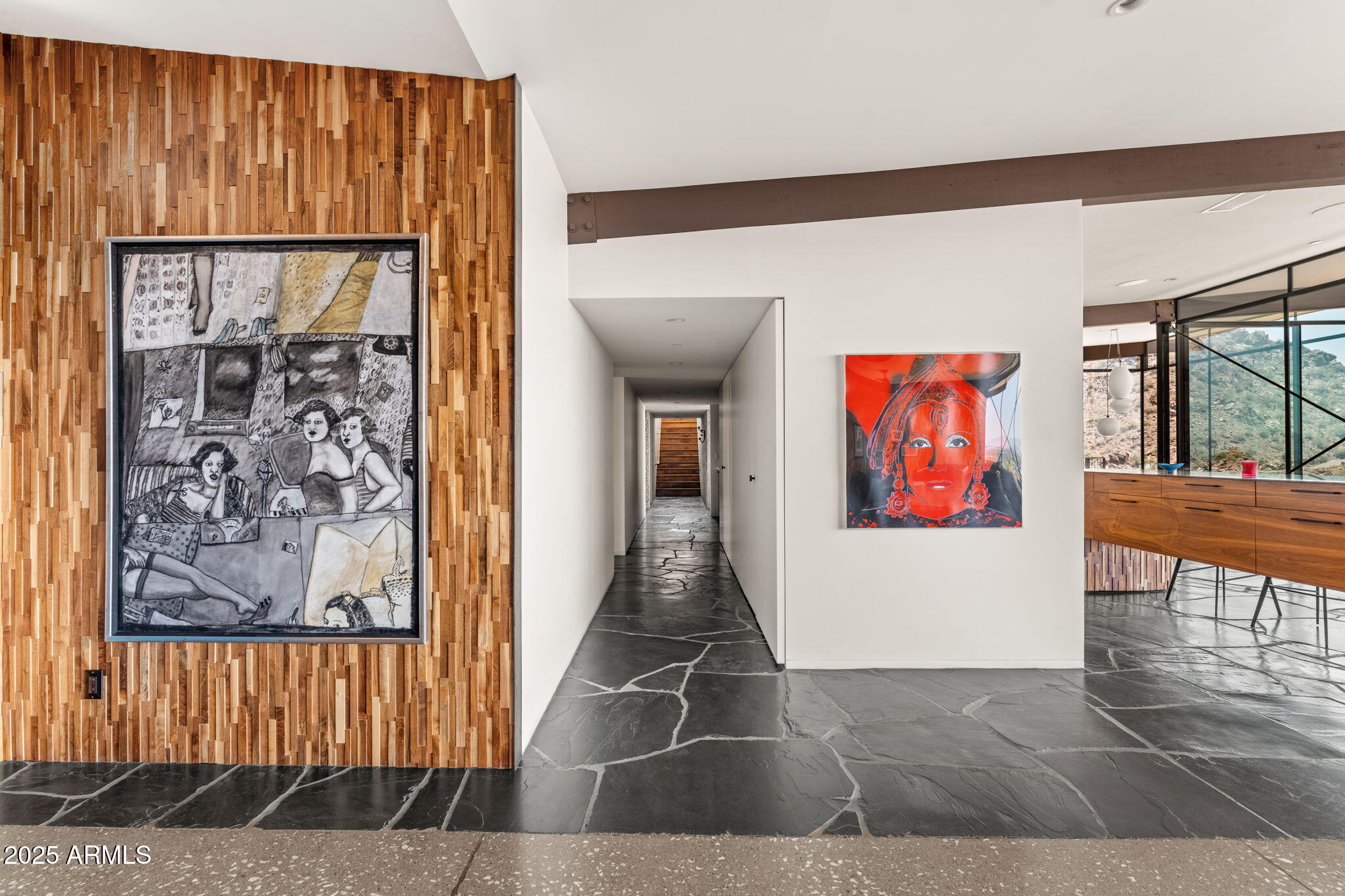 4925 East Red Rock Drive, Unit 43 Phoenix, AZ 85018 - Photo 56 of 99 a view of a hallway with wooden floor and windows