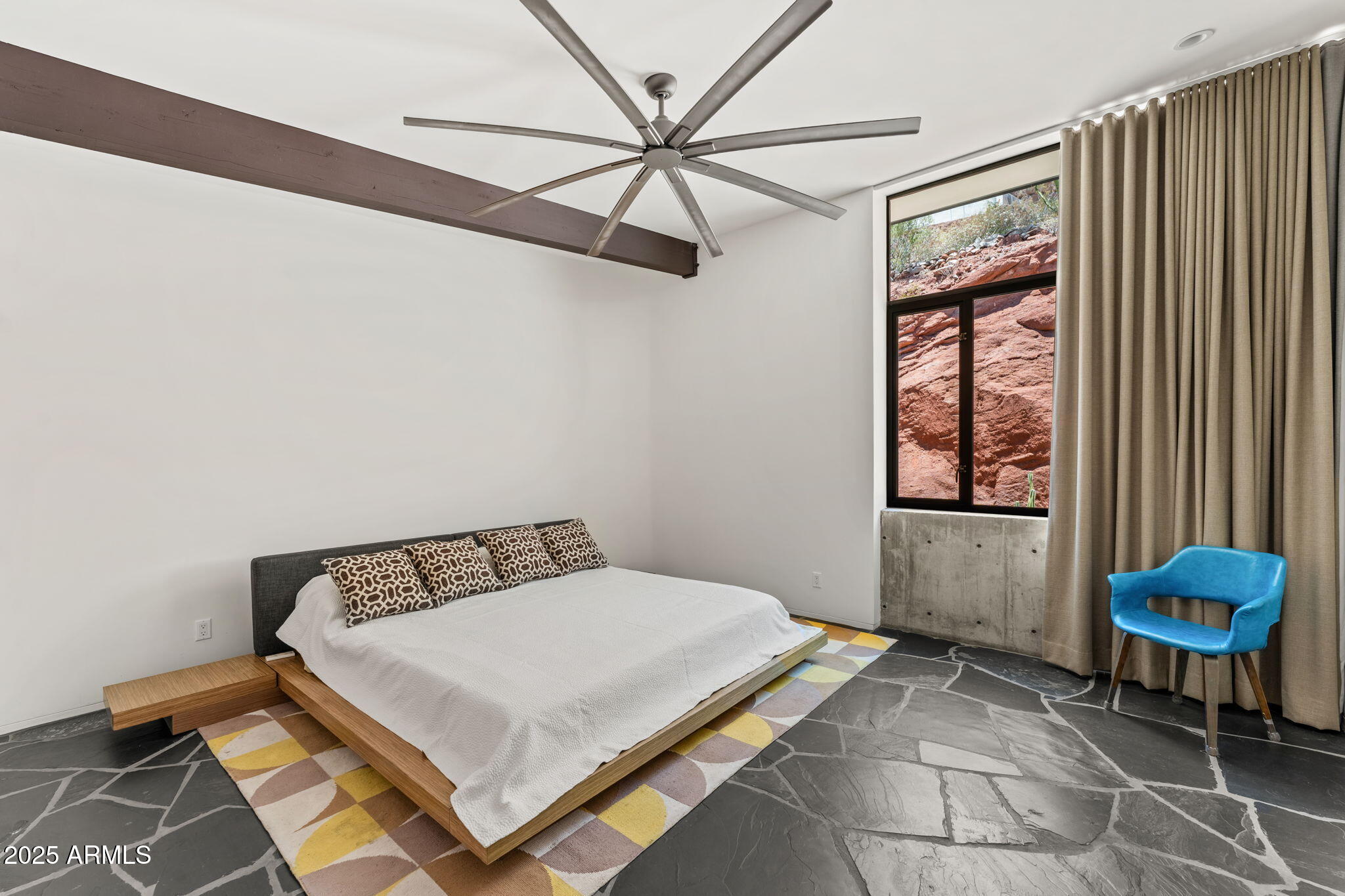 4925 East Red Rock Drive, Unit 43 Phoenix, AZ 85018 - Photo 57 of 99 a bedroom with a bed and a window