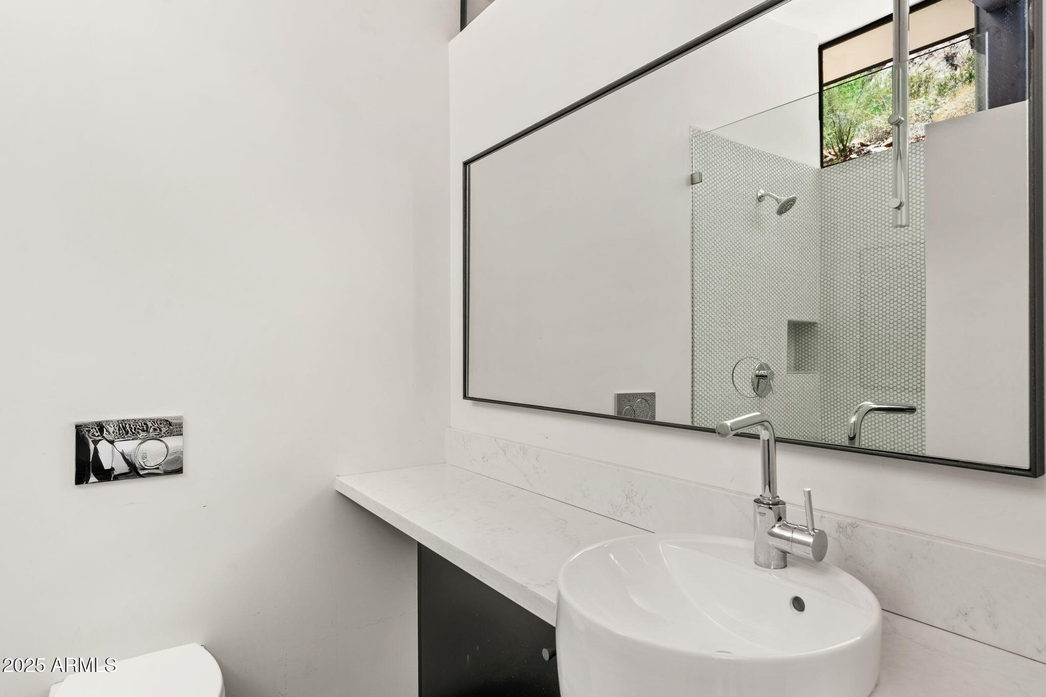 4925 East Red Rock Drive, Unit 43 Phoenix, AZ 85018 - Photo 58 of 99 a bathroom with a sink a toilet and a mirror