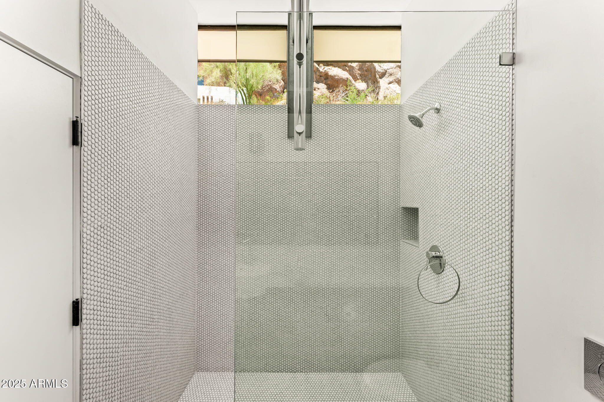 4925 East Red Rock Drive, Unit 43 Phoenix, AZ 85018 - Photo 59 of 99 a bathroom with a glass shower door