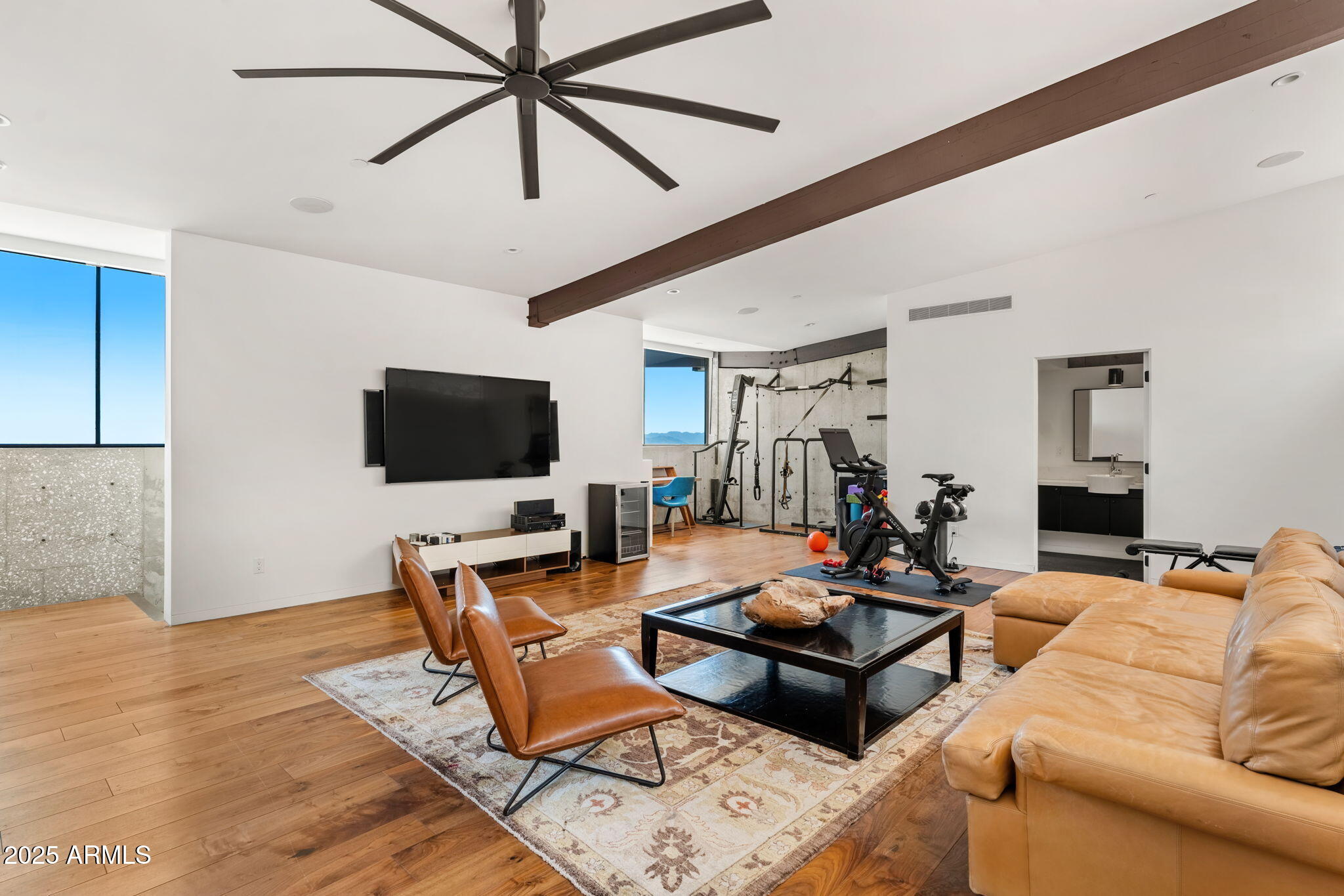 4925 East Red Rock Drive, Unit 43 Phoenix, AZ 85018 - Photo 67 of 99 a living room with furniture and a flat screen tv