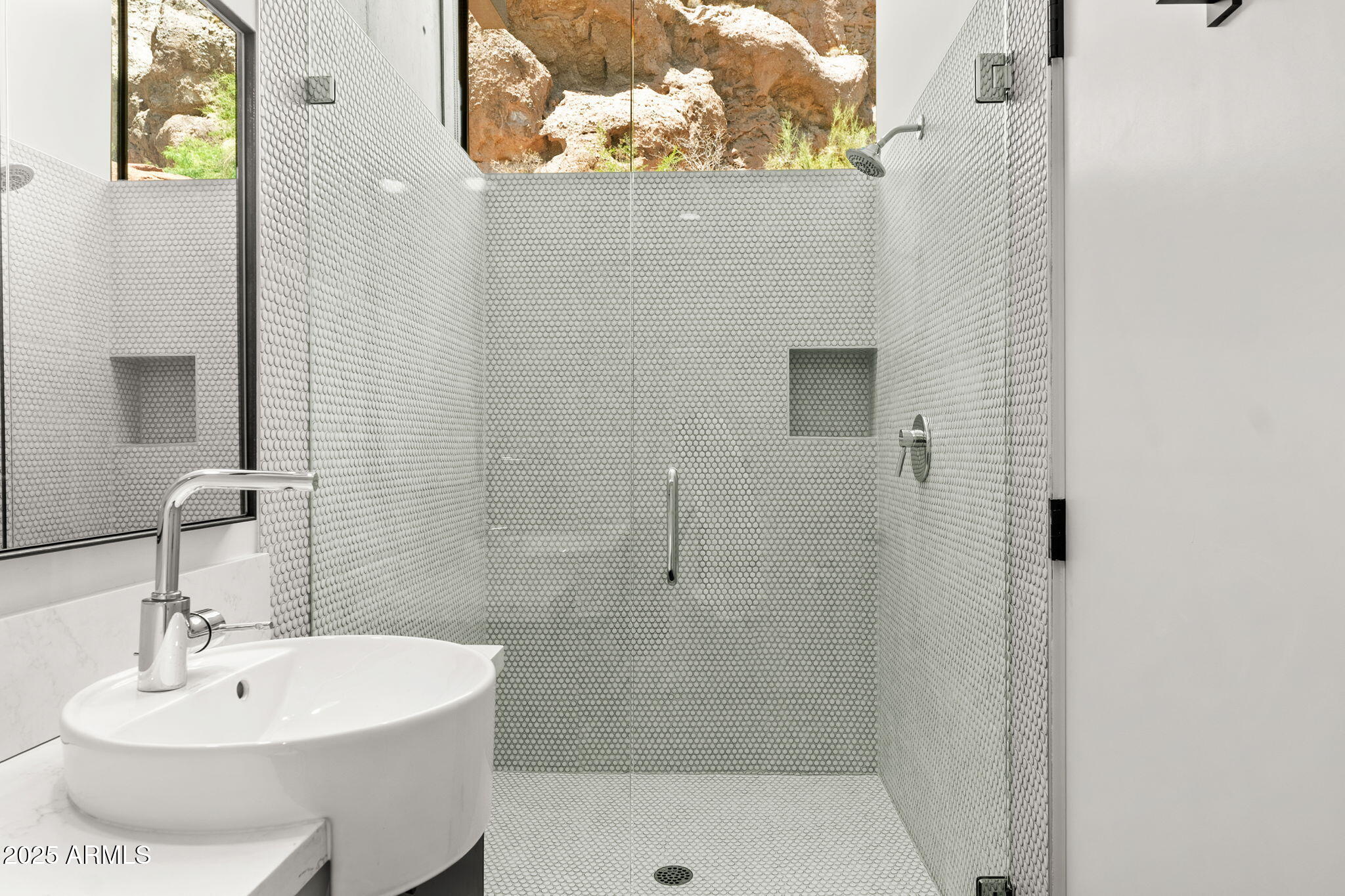 4925 East Red Rock Drive, Unit 43 Phoenix, AZ 85018 - Photo 70 of 99 a bathroom with a sink a shower and mirror