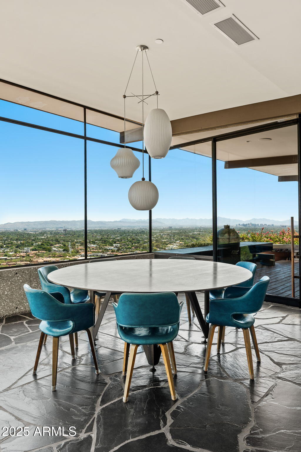4925 East Red Rock Drive, Unit 43 Phoenix, AZ 85018 - Photo 77 of 99 a view of a dining room with furniture window and wooden floor