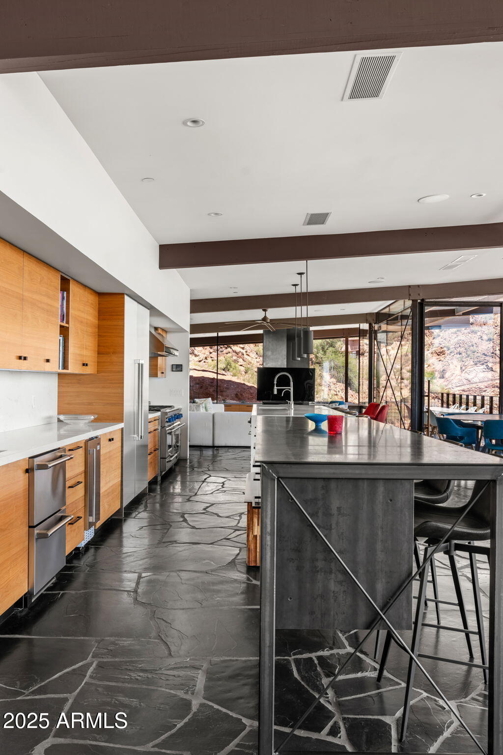 4925 East Red Rock Drive, Unit 43 Phoenix, AZ 85018 - Photo 82 of 99 a kitchen with stainless steel appliances granite countertop a stove and cabinets
