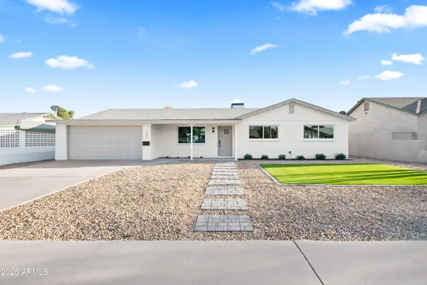 a house with swimming pool in front of it