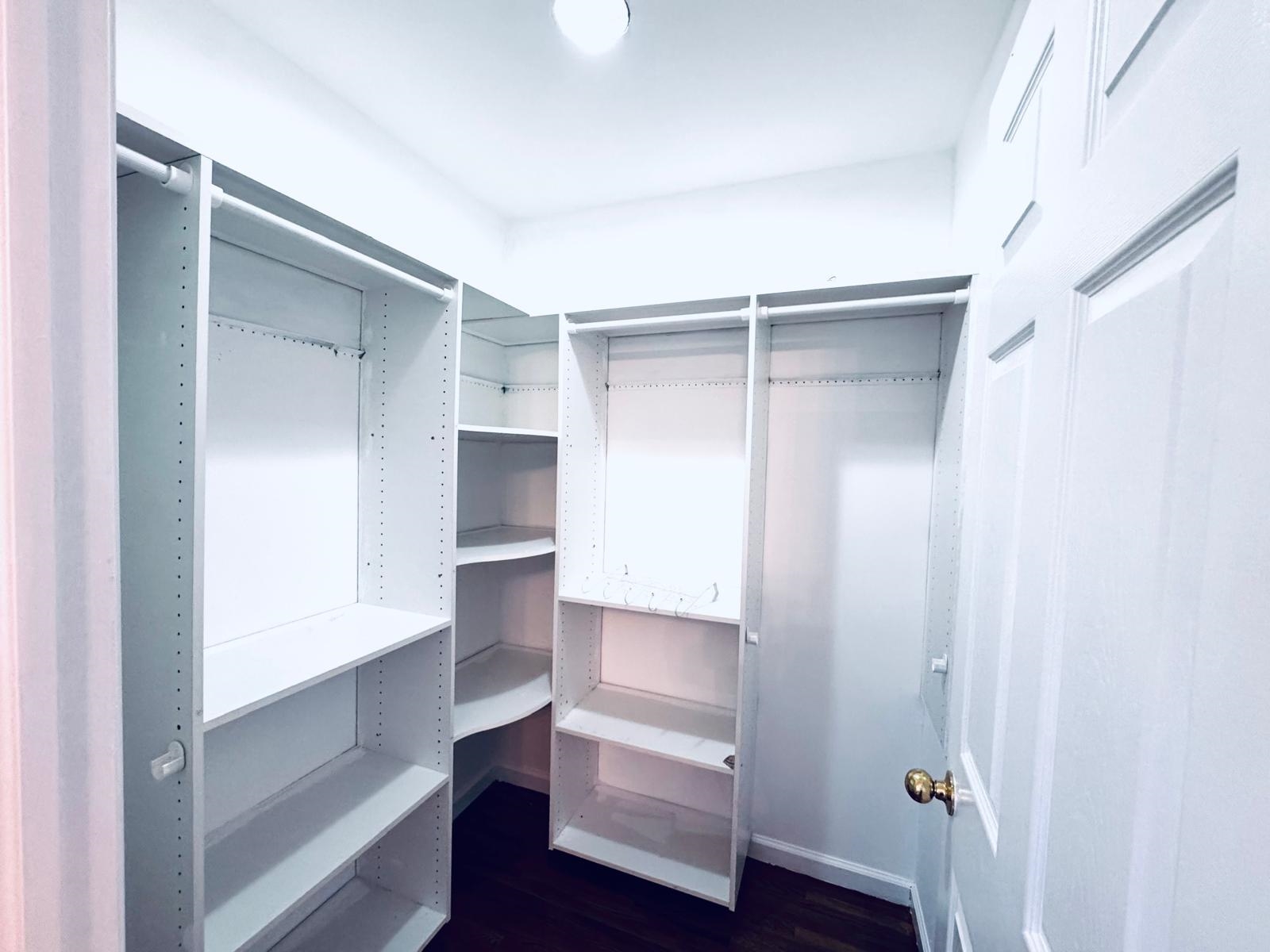 161 West 53rd Street, Unit 2 Bayonne, NJ 07002 - Photo 14 of 19 a view of walk in closet with empty racks