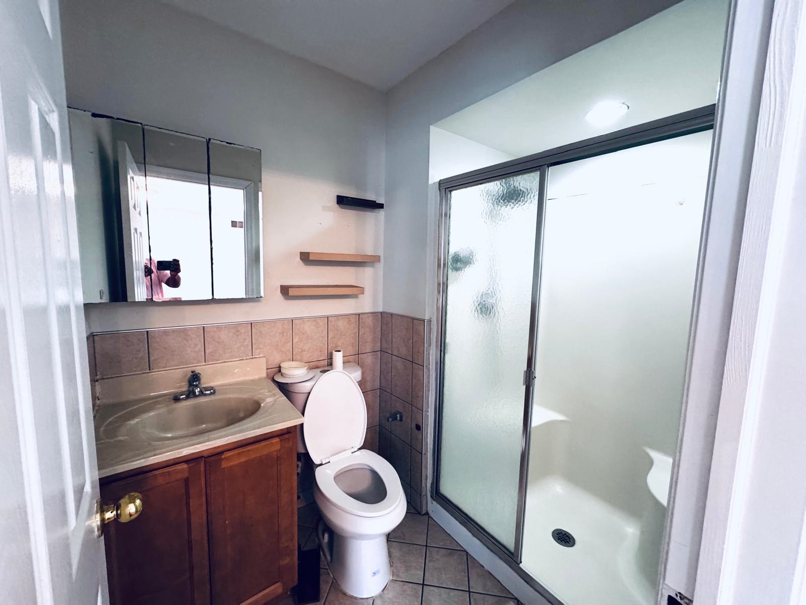 161 West 53rd Street, Unit 2 Bayonne, NJ 07002 - Photo 15 of 19 a bathroom with a sink toilet and shower