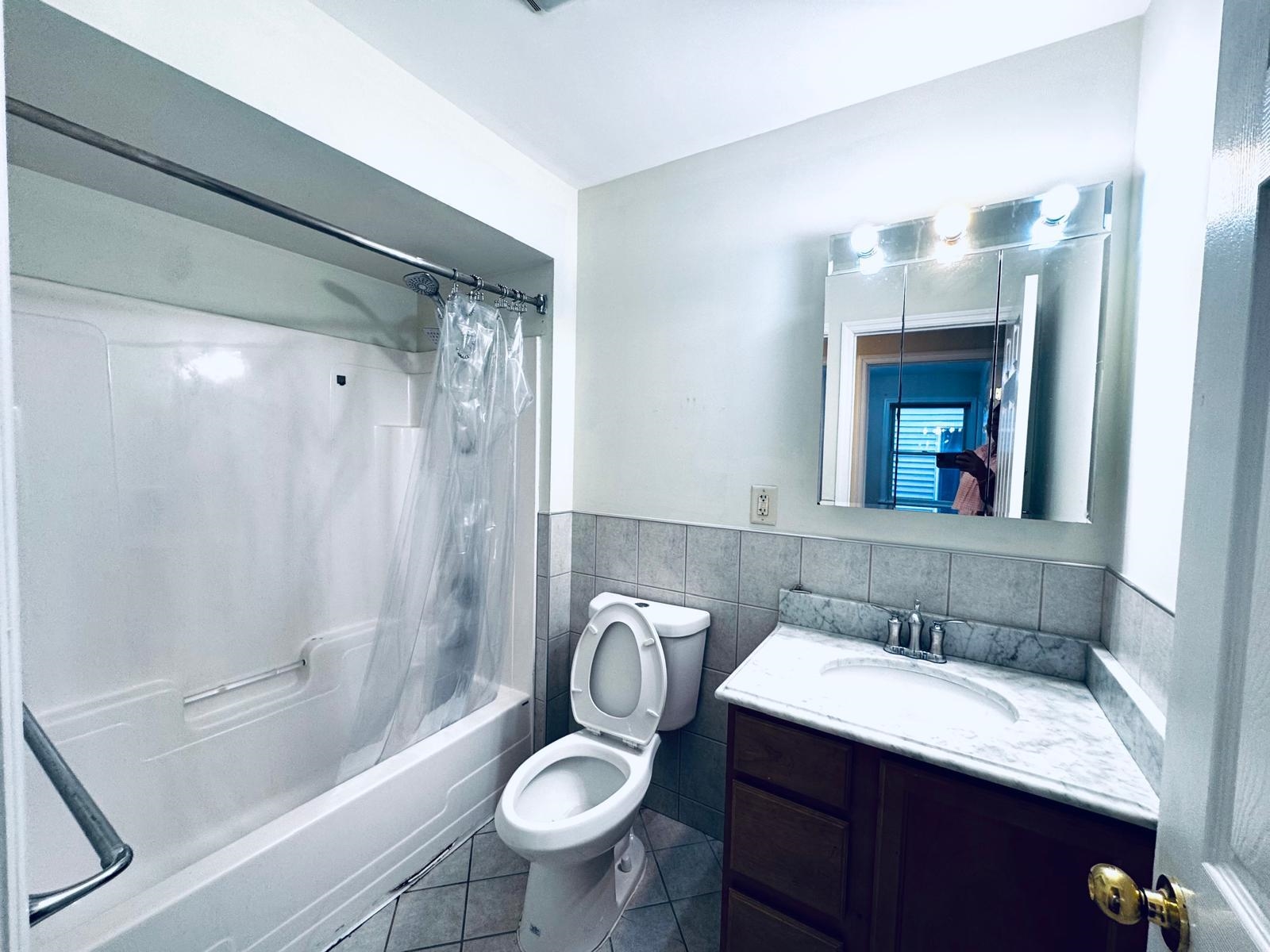 161 West 53rd Street, Unit 2 Bayonne, NJ 07002 - Photo 19 of 19 a bathroom with a sink toilet and shower