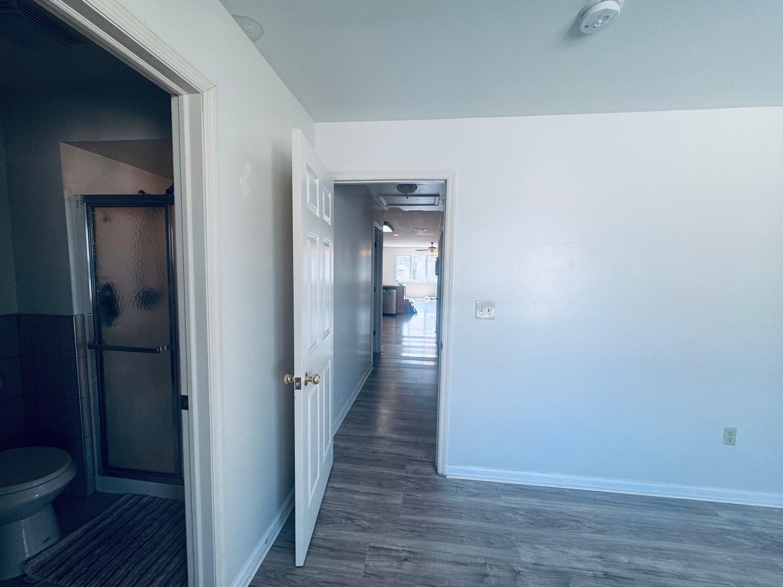 161 West 53rd Street, Unit 2 Bayonne, NJ 07002 - Photo 7 of 19 a view of a bathroom from the hallway