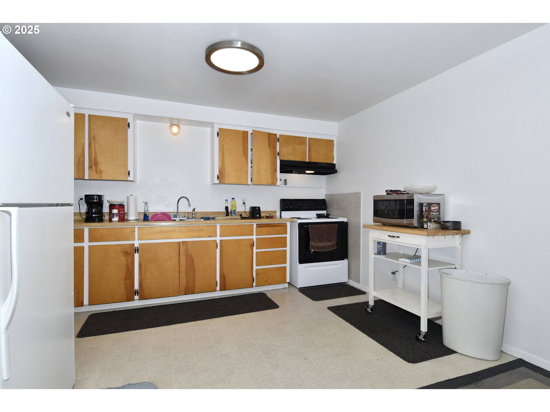 1126 South Jasper Street Cornelius, OR 97113 - Photo 12 of 47 a kitchen with granite countertop a sink cabinets and stainless steel appliances