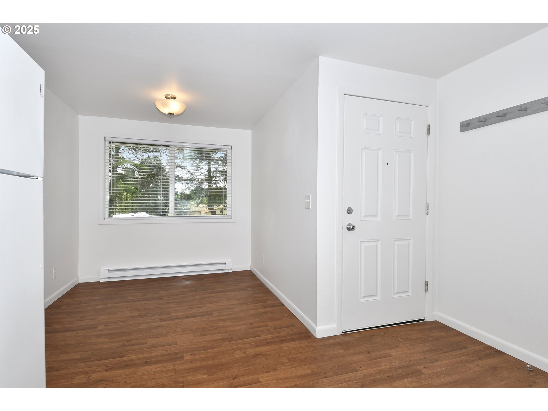 1126 South Jasper Street Cornelius, OR 97113 - Photo 21 of 47 a view of an empty room with wooden floor and a window