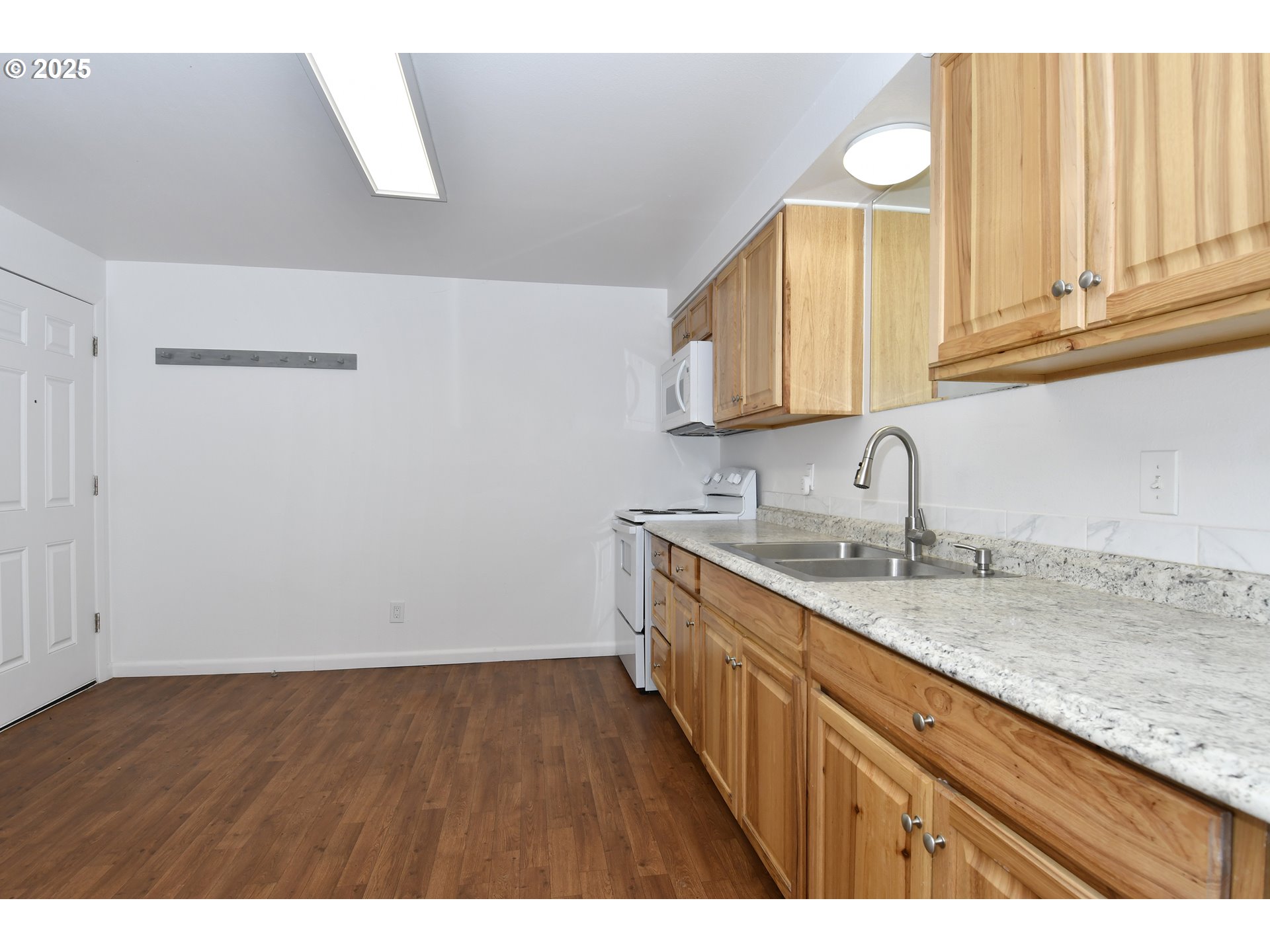 1126 South Jasper Street Cornelius, OR 97113 - Photo 23 of 47 a kitchen with sink and cabinets