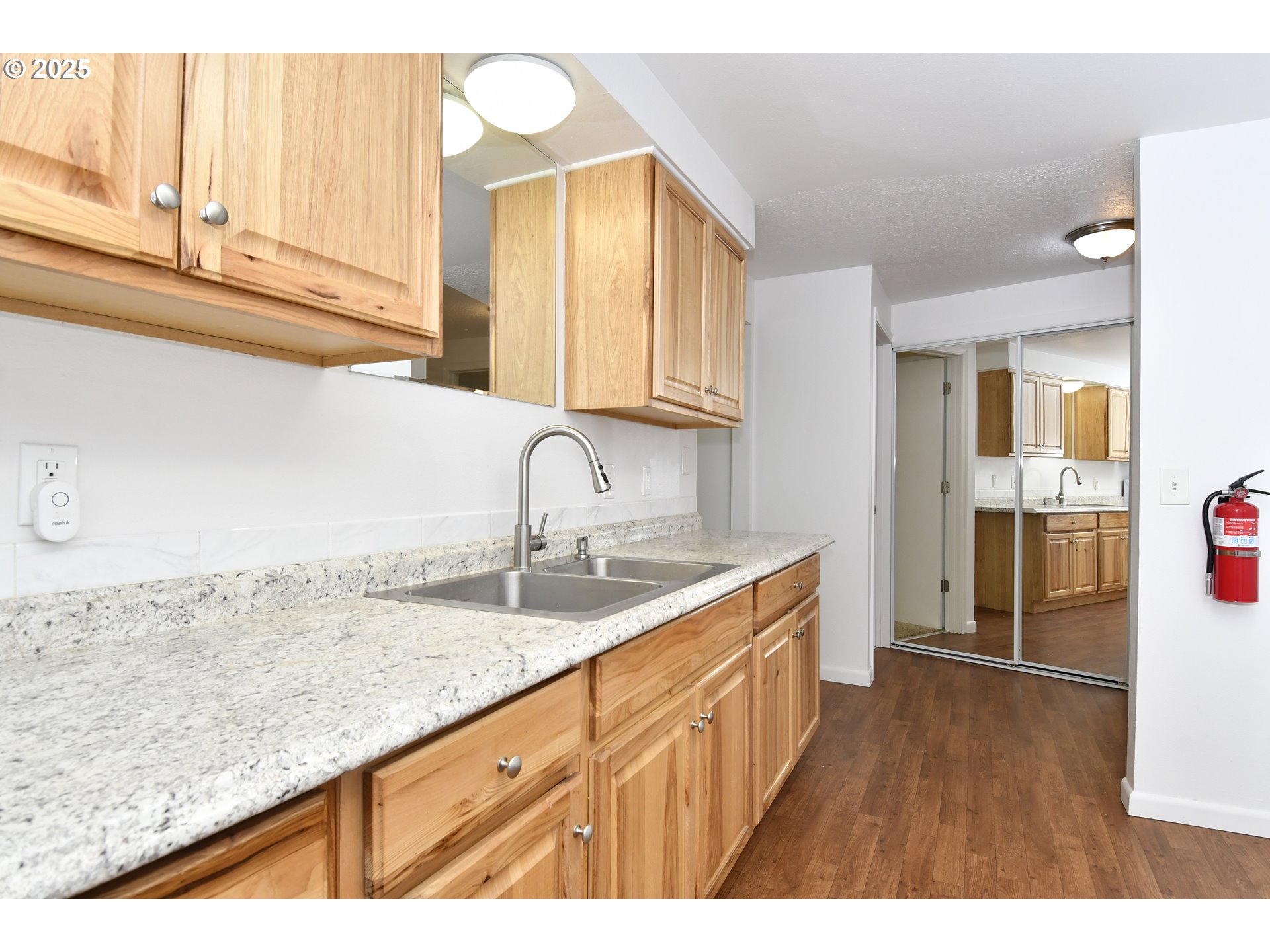 1126 South Jasper Street Cornelius, OR 97113 - Photo 24 of 47 a kitchen with granite countertop a sink and cabinets