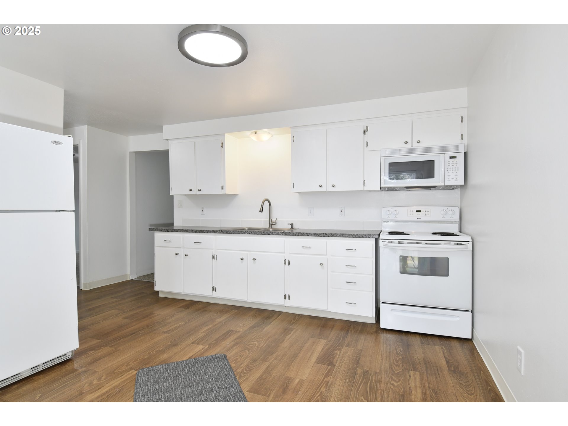 1126 South Jasper Street Cornelius, OR 97113 - Photo 30 of 47 a kitchen with cabinets stainless steel appliances and a window