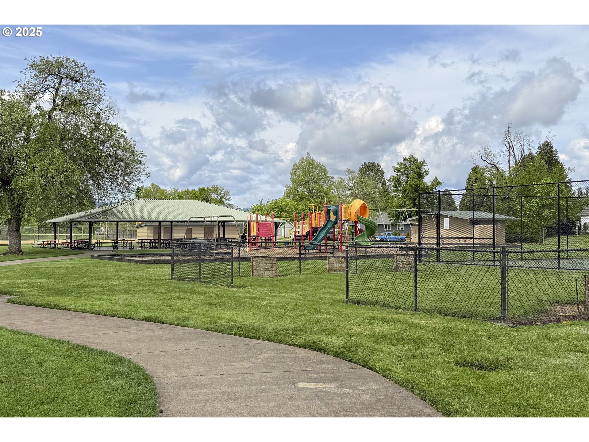 1126 South Jasper Street Cornelius, OR 97113 - Photo 8 of 47 a view of a park with large trees