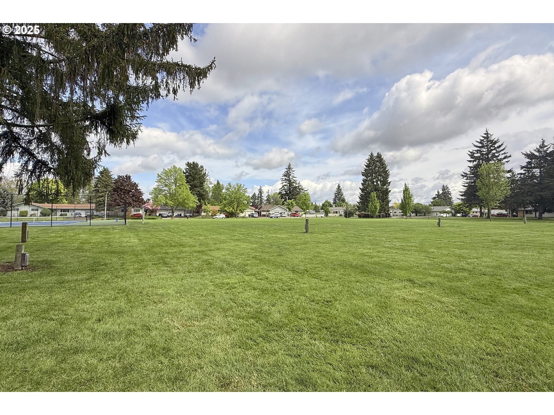 1126 South Jasper Street Cornelius, OR 97113 - Photo 9 of 47 a backyard of a house with lots of green space