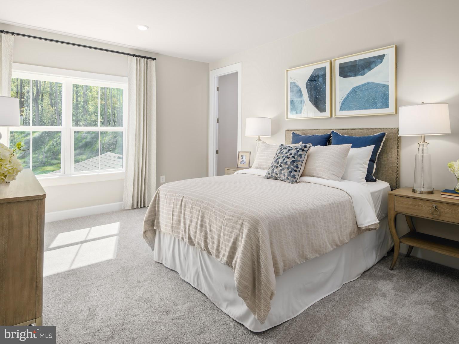 1222 Bear Branch Road Laurel, MD 20708 - Photo 11 of 17 a bed sitting in a bedroom next to a window