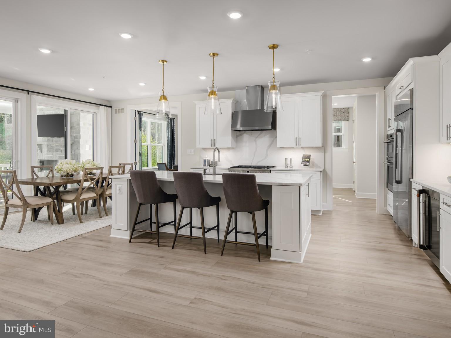 1222 Bear Branch Road Laurel, MD 20708 - Photo 4 of 17 a large kitchen with a table and chairs