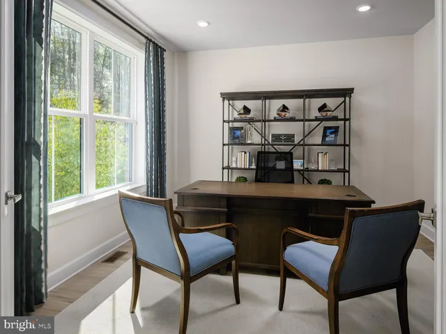 a view of a workspace with furniture