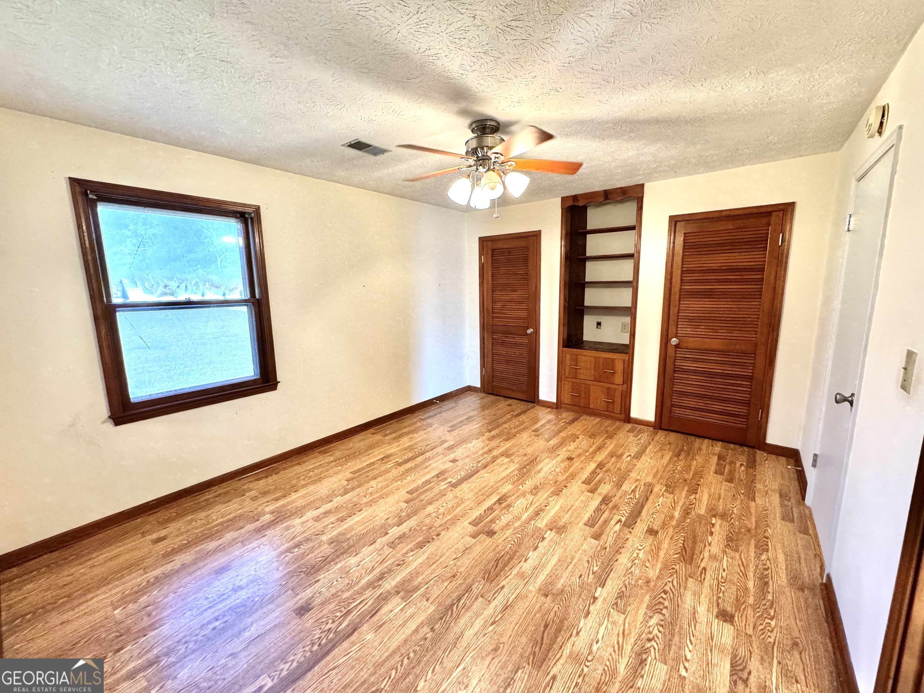 1760 Fears Road Rutledge, GA 30663 - Photo 21 of 68 a view of empty room with wooden floor