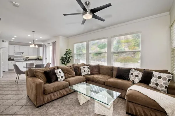 a living room with furniture and a large window