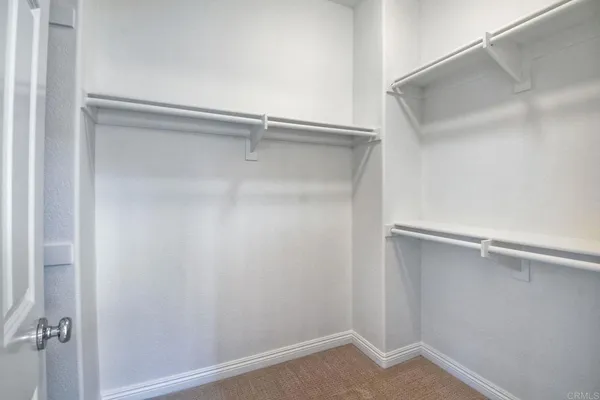 a view of an empty walk in closet