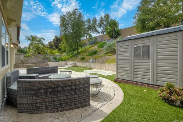 a view of outdoor sitting area with furniture