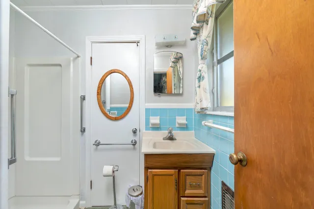 a bathroom with a sink and a mirror