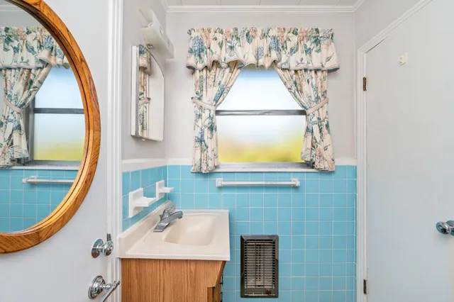 an empty room with a ceiling fan and a window