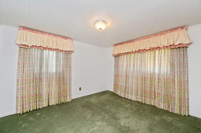 an empty room with closet area