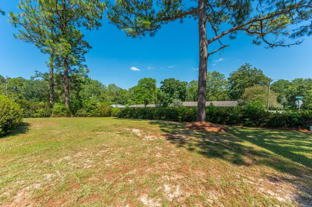 a view of a backyard of the house