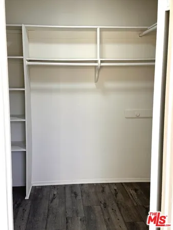 a view of an empty walk in closet