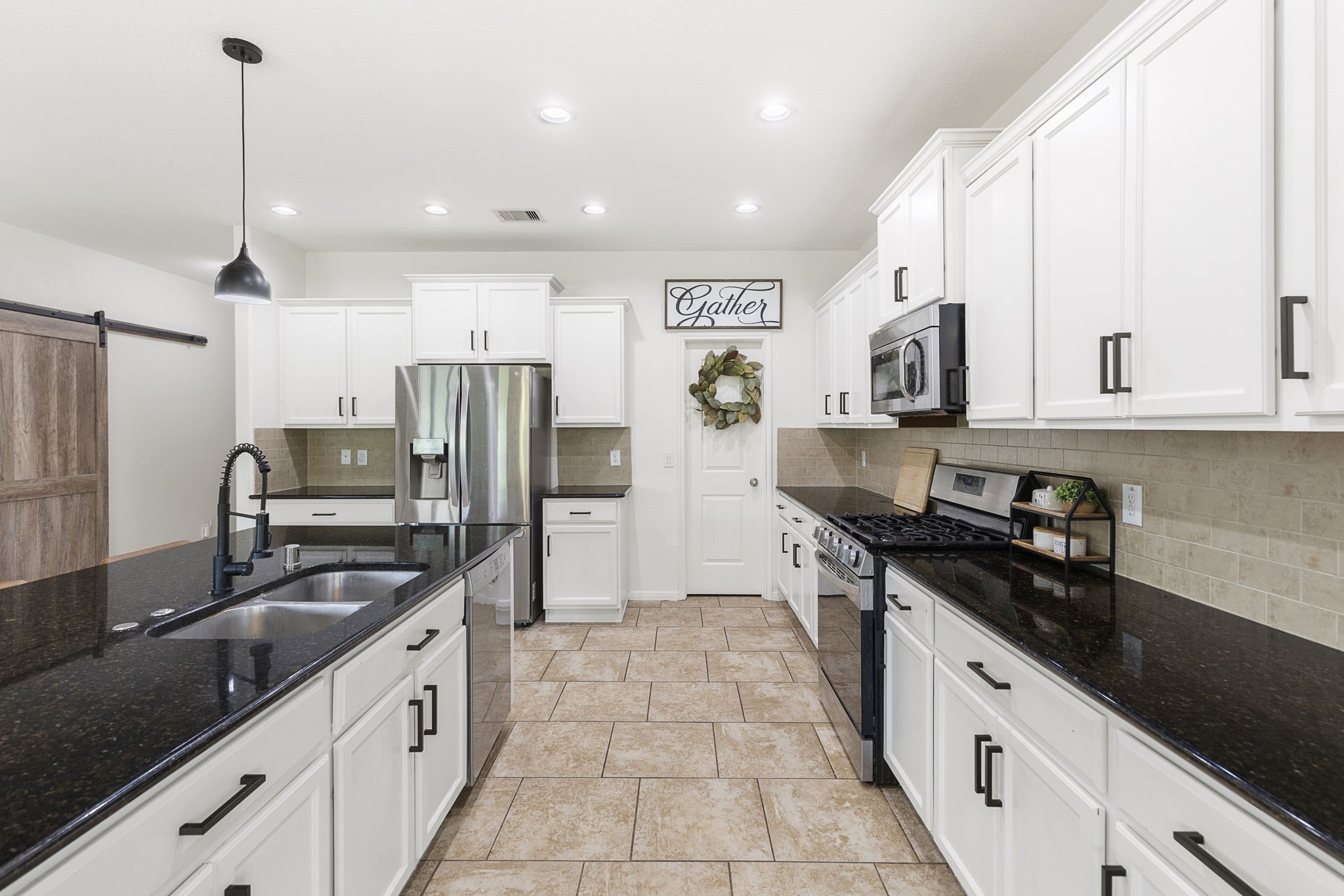 22810 Dale River Road Tomball, TX 77375 - Photo 9 of 44 This kitchen features stainless appliances and large walk-in pantry.