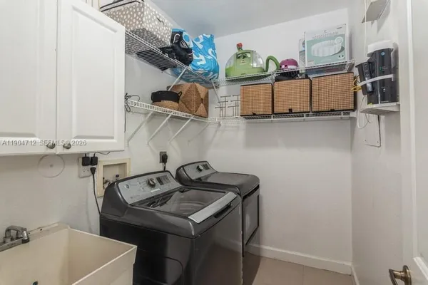 a utility room with dryer and washer