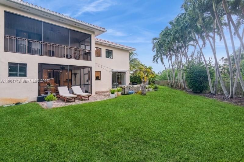 18704 Southwest 76th Court Cutler Bay, FL 33157 - Photo 34 of 47 a view of a house with backyard porch and sitting area