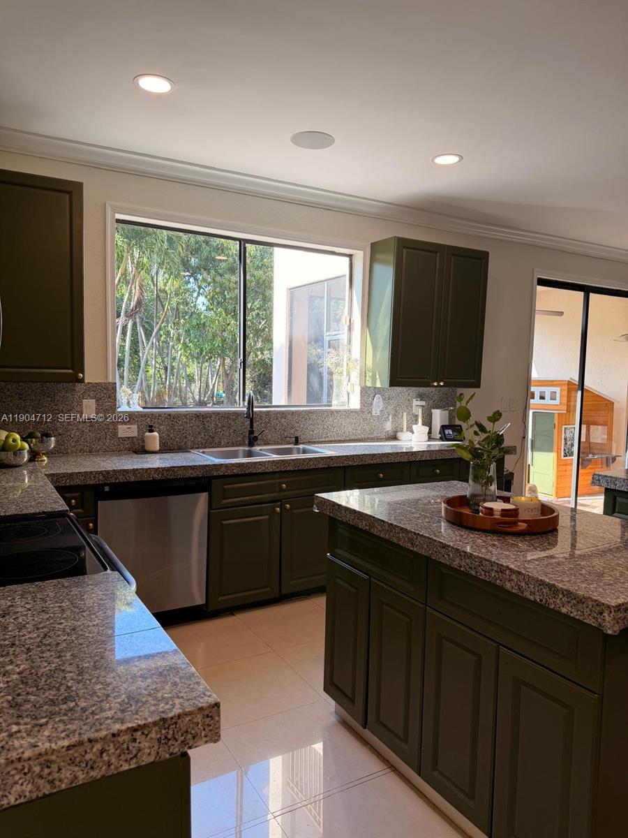 18704 Southwest 76th Court Cutler Bay, FL 33157 - Photo 44 of 47 a kitchen with sink a window and cabinets