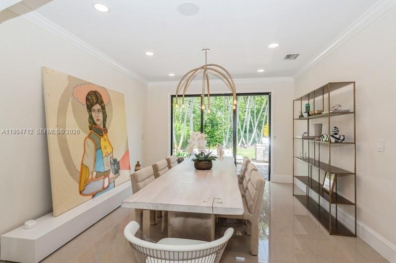 18704 Southwest 76th Court Cutler Bay, FL 33157 - Photo 8 of 47 a dining room with furniture and a floor to ceiling window