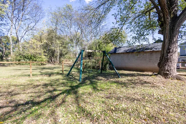 a view of outdoor space with deck and tree
