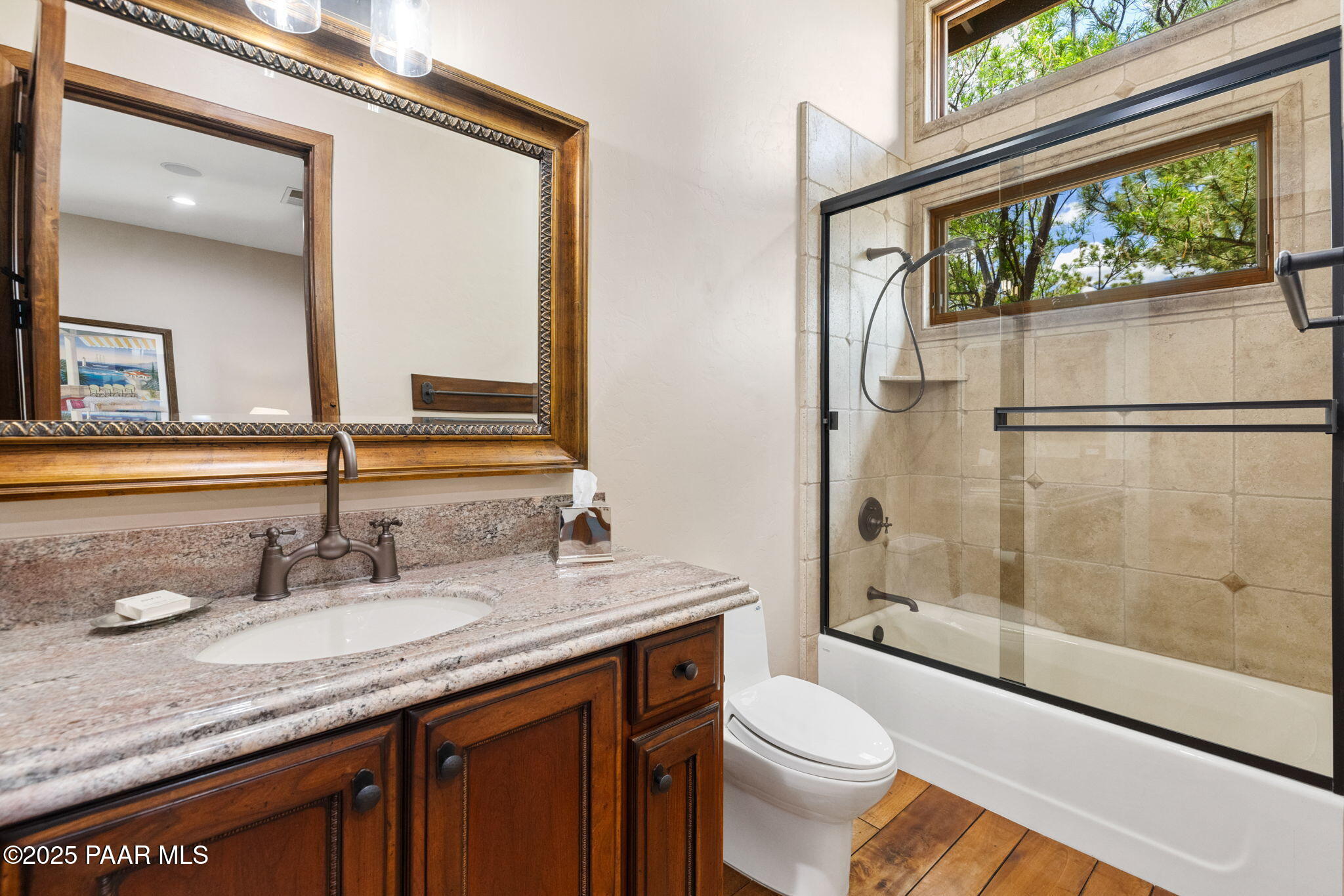 5350 West Three Forks Road Prescott, AZ 86305 - Photo 34 of 99 a bathroom with a granite countertop sink toilet and shower