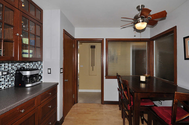334 Stratford Road Des Plaines, IL 60016 - Photo 3 of 16 a kitchen that has a table and chairs in it