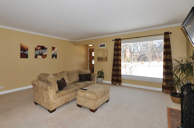334 Stratford Road Des Plaines, IL 60016 - Photo 5 of 16 a living room with furniture and a large window