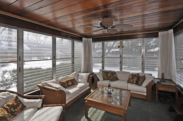 334 Stratford Road Des Plaines, IL 60016 - Photo 9 of 16 a living room with furniture and floor to ceiling windows