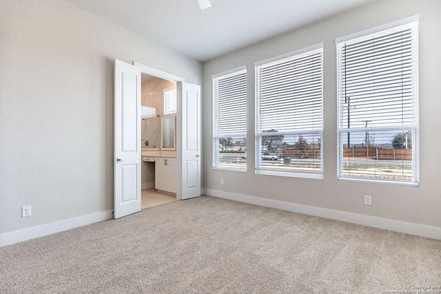 an empty room with a bathroom