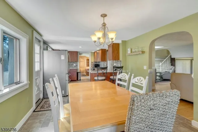 a kitchen with sink refrigerator and microwave