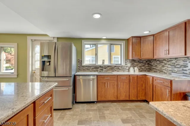 a living room with furniture ceiling fan and a rug