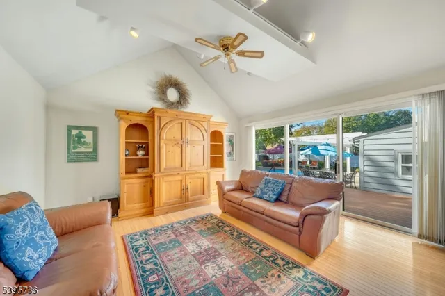 a bed sitting in a spacious bedroom next to a window