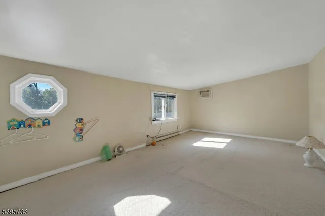 a view of a patio with table and chairs under an umbrella